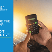 Inside the Solar Tax Credit Incentive Blog image alongside calculator in person's hands in front of solar panels