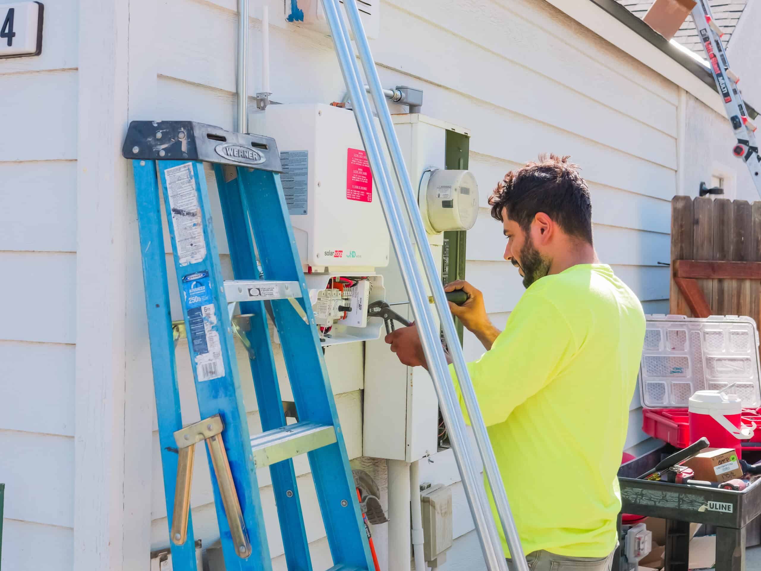 image of a technician troubleshooting a solar edge inverter