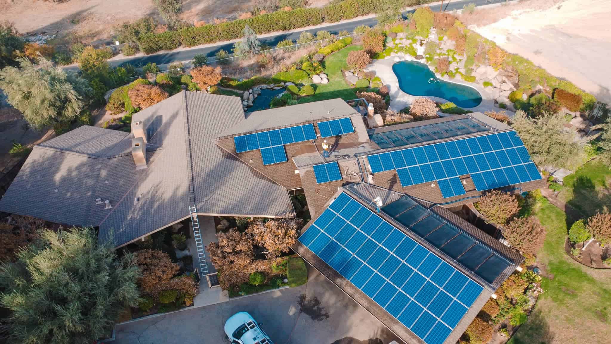 birds eye view of a home equipped with solar all around