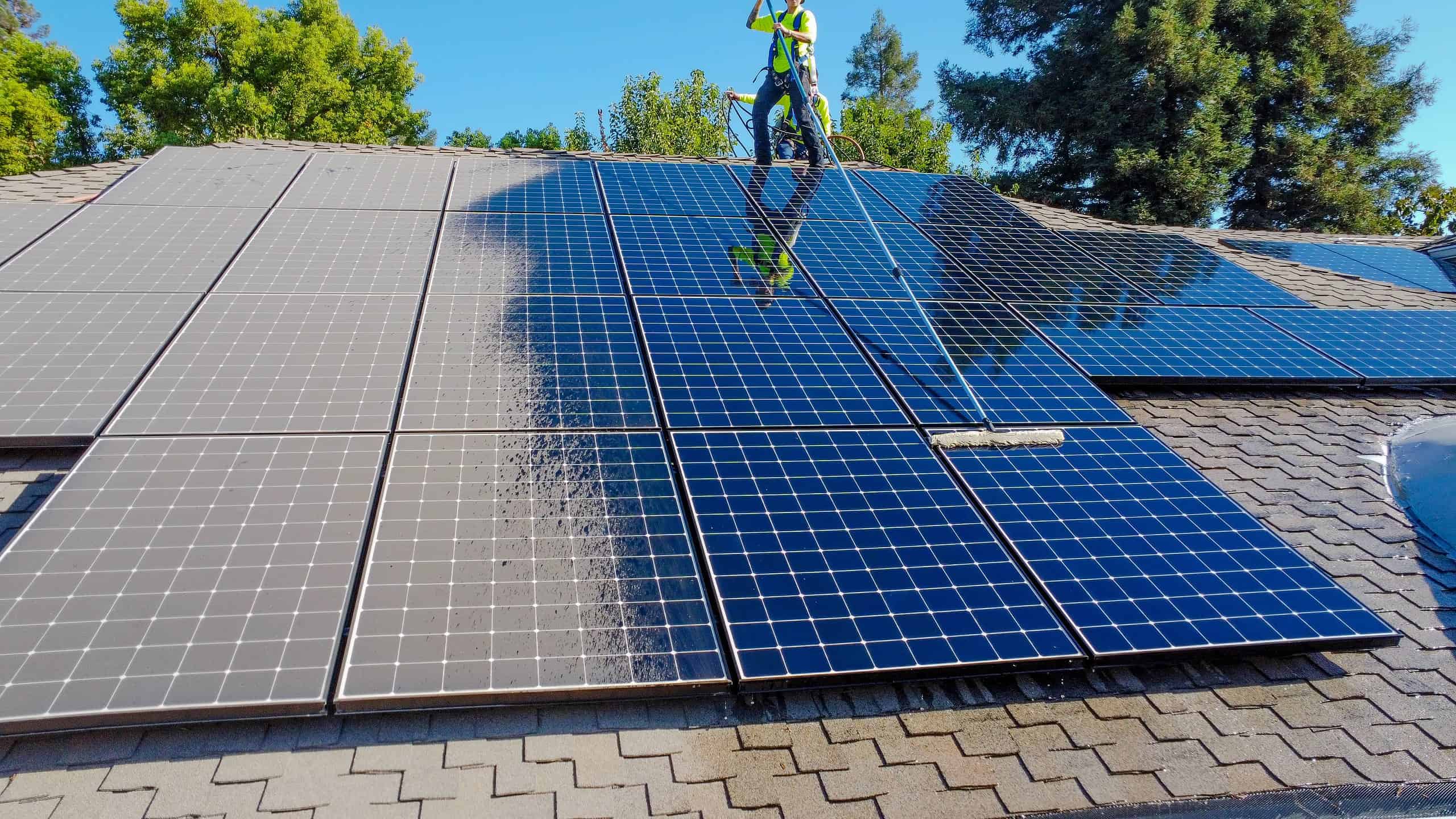 solar maintenance crew cleaning panels