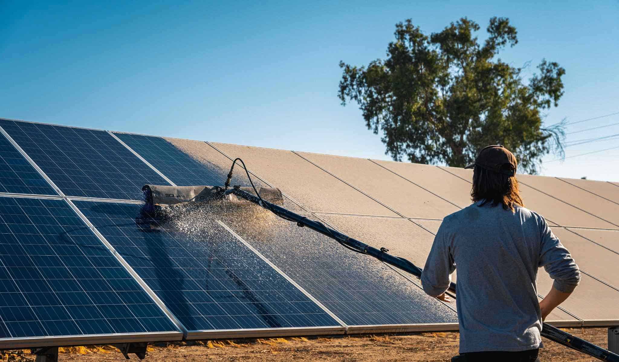 solar maintenance crew cleaning panels