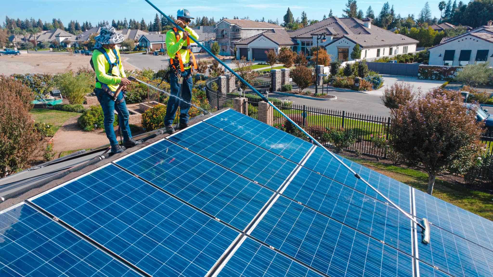solar maintenance crew cleaning panels