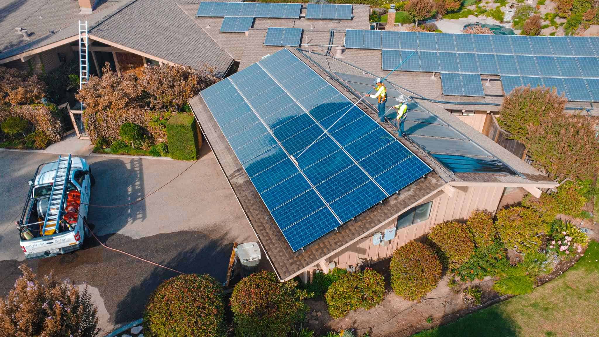 solar maintenance crew cleaning panels