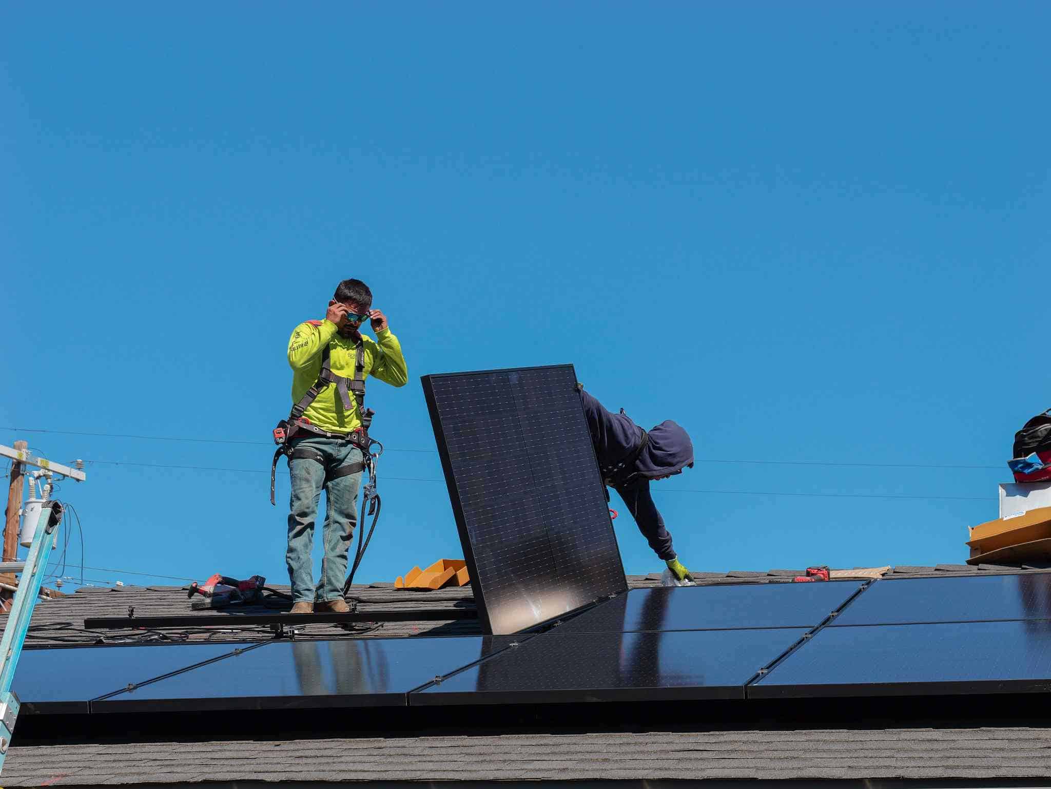 solar crew working on installing solar panels